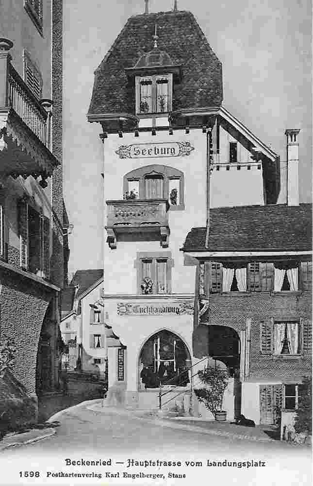 Beckenried. Hauptstraße mit der Seeburg und der Tuchhandlung, Landungsplatz, 1910